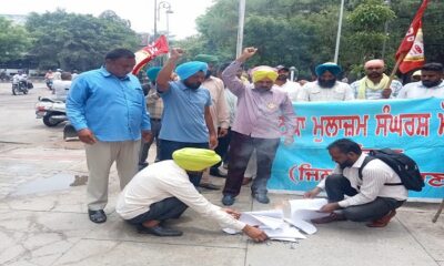 The Joint Employees Front burnt copies of the budget across Punjab