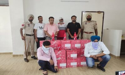 20 packs of Johnnie Walker Red Label whiskey stolen from 2 cars by Excise Department, two arrested