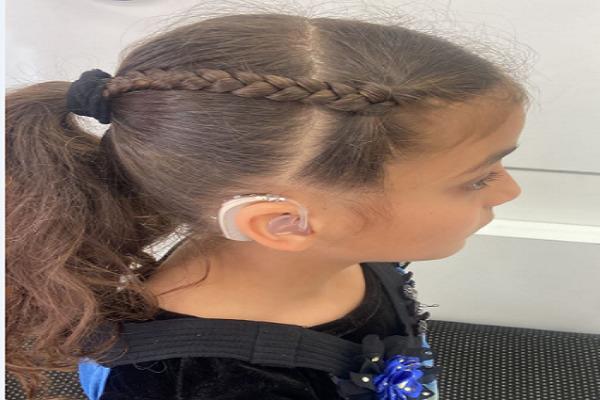 A needy 9-year-old girl was provided with a hearing aid