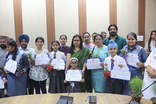 Certificates and plants were distributed to 52 students for their best artwork